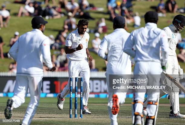 Suranga Lakmal of Sri Lanka celebrates after taking the wicket of Mitchell Santner of New Zealand on day three of the second Test cricket match...