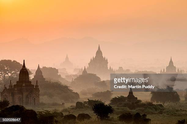 bagan, ancient temples in mist at sunrise - myanmar bildbanksfoton och bilder