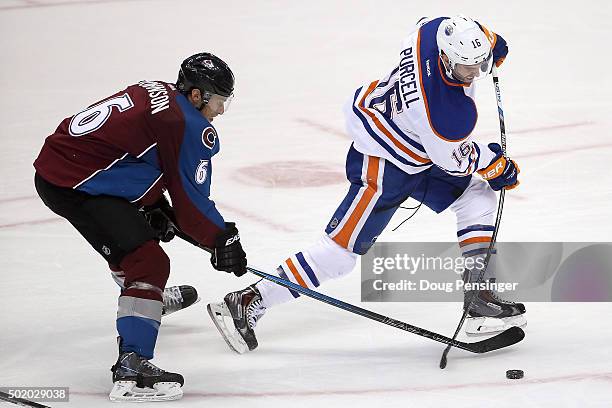 Teddy Purcell of the Edmonton Oilers takes a shot against Erik Johnson of the Colorado Avalanche at Pepsi Center on December 19, 2015 in Denver,...