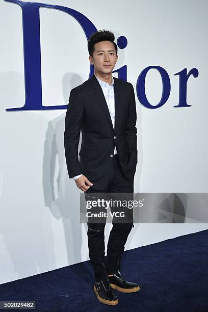 Singer and actor Han Geng poses on carpet during Dior S/S Repeat Show at the Phoenix International Media Center on December 19, 2015 in Beijing,...