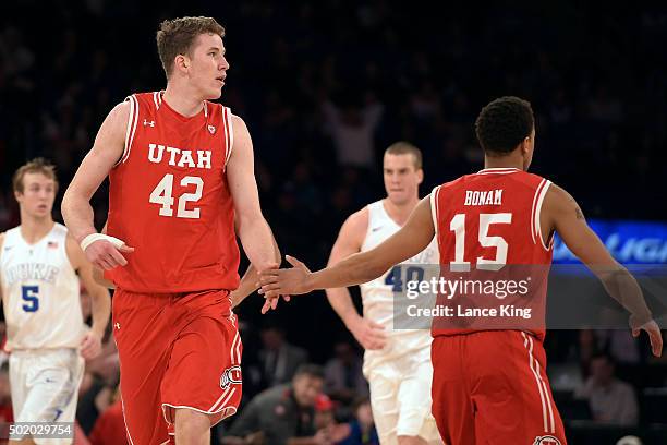 Jakob Poeltl and Lorenzo Bonam of the Utah Utes react following a play against the Duke Blue Devils during the Ameritas Insurance Classic at Madison...