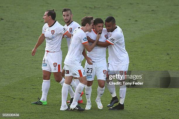 Dimitri Petratos of the Roar celebrates a goal with team mates during the round 11 A-League match between the Central Coast Mariners and the Brisbane...
