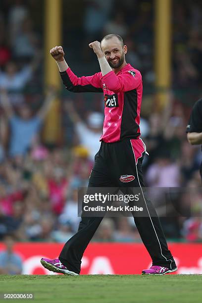 Nathan Lyon of the Sixers celebrates taking the wicket of Shaun Tait of the Hurricanes to secure victory and a five wicket haul during the Big Bash...