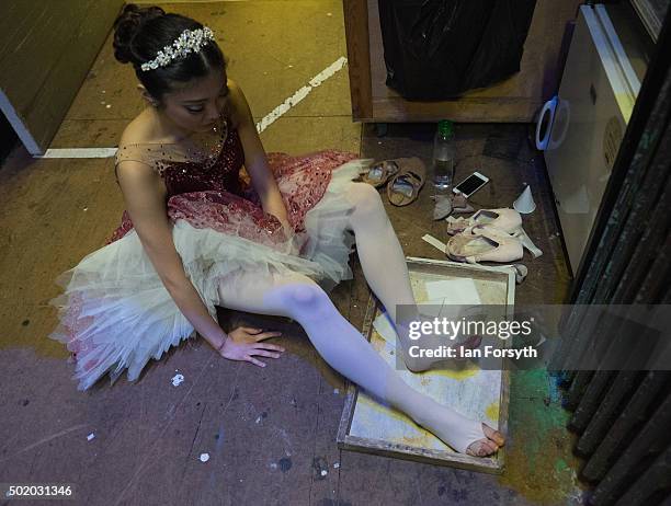 Ballet dancer Ayami Miyata rubs her feet with Rosin to improve friction ahead a performance of The Nutcracker by Northern Ballet at the Grand Theatre...