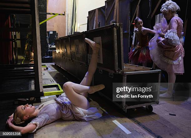 First Soloist Antoinette Brooks-Daw stretches her legs after act one during a performance of The Nutcracker by Northern Ballet at the Grand Theatre...