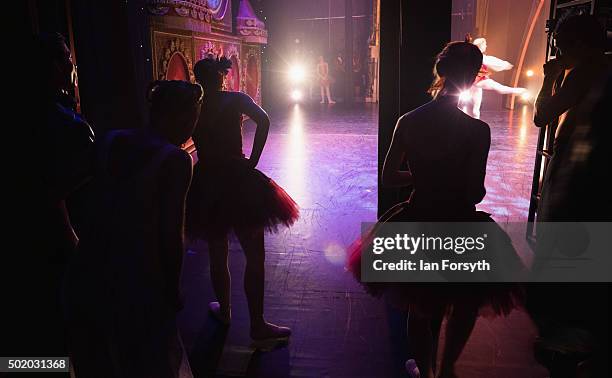 Members of Northern Ballet stand in the wings and watch a performance by dancer Sean Bates as he dances the role of the Cavalier during a performance...
