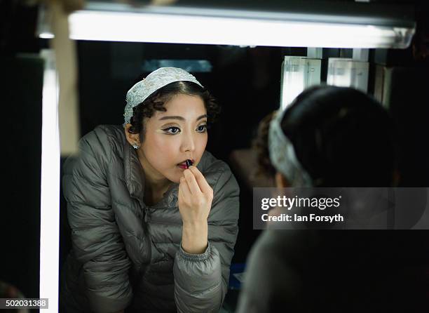 Ballet Dancer Ayami Miyata applies lipstick as final preparations take place at the Grand Theatre ahead of a performance by Northern Ballet of The...
