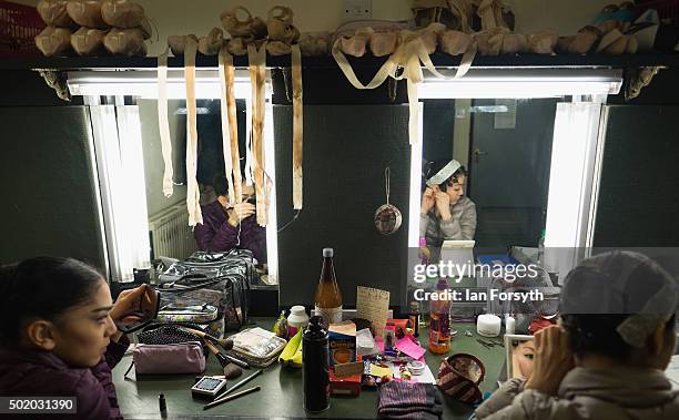 Ballet dancers Rachael Gillespie and Ayami Miyata arrange their hair and makeup ahead of a performance by Northern Ballet of The Nutcracker at the...