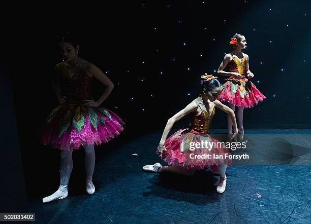 Ballet dancers appearing as snow maidens warm up between acts during a performance of The Nutcracker by Northern Ballet at the Grand Theatre on...