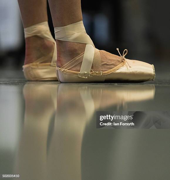 Ballet dancer stands in her pointe shoes during company class at the headquarters of Northern Ballet ahead of a performance later that evening of The...