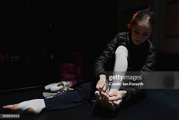 Dancer tapes her feet as final preparations take place at the Grand Theatre ahead of a performance of The Nutcracker by Northern Ballet on December...