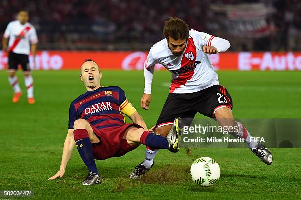Andres Iniesta of Barcelona is fouled by Leonardo Ponzio of River Plate during the FIFA Club World Cup Final between River Plate and FC Barcelona at...
