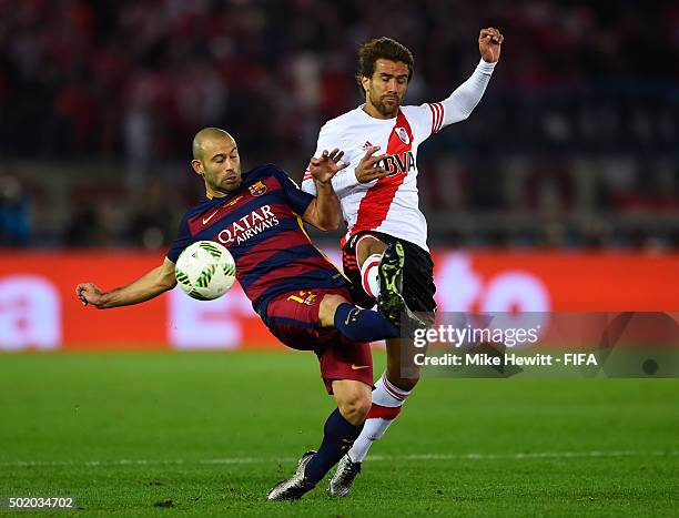 Javier Mascherano of Barcelona and Leonardo Ponzio of River Plate compete for the ball during the FIFA Club World Cup Final between River Plate and...