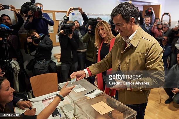 Leader of Spain's Socialist Party and candidate for general elections Pedro Sanchez and his wife Begona Fernandez cast their votes during General...