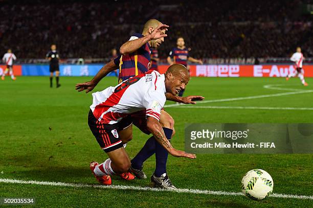 Carlos Sanchez of River Plate is fouled by Javier Mascherano of Barcelona during the FIFA Club World Cup Final between River Plate and FC Barcelona...