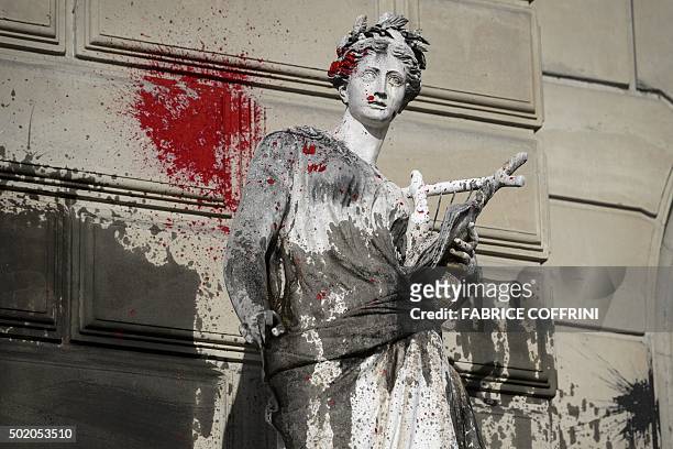 Picture shows a statue outside the "Grand Theatre de Geneve" opera house on December 20, 2015 in Geneva, after it was vandalised during a...