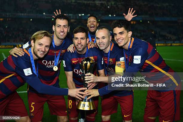 Ivan Rakatic, Sergio Buequets, Jordi Alba, Adriano, Andres Iniesta and Marc Bartra of Barcelona celebrate with the trophy following their team's 3-0...