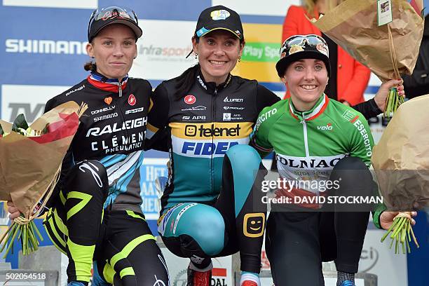 French Caroline Mani, British Nikki Harris and Italian Eva Lechner celebrate on the podium at the end of the women's elite race in the fourth stage...