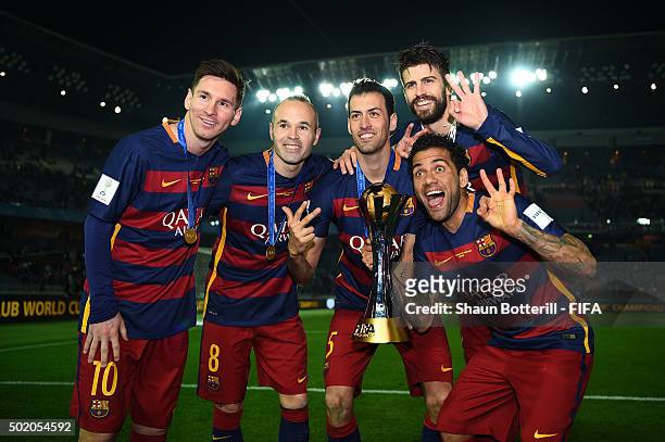 Lionel Messi, Andres Iniesta, Sergio Busquets, Gerard Pique and Dani Alves of Barcelona celebrate with the trophy following their team's 3-0 victory...