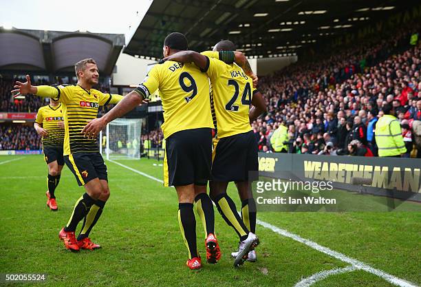 Odion Ighalo of Watford celebrates with Troy Deeney and team mates as he scores their second goal during the Barclays Premier League match between...