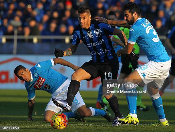 German Gustavo Denis of Atalanta BC is challenged by Raul Albiol of SSC Napoli during the Serie A match between Atalanta BC and SSC Napoli at Stadio...