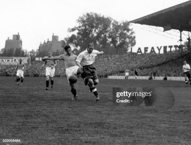 French and Belgian football players fight for the ball during the friendly match France-England, on May 26 in Paris.