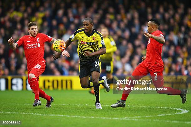 Odion Ighalo of Watford takes on Alberto Moreno and Nathaniel Clyne of Liverpool during the Barclays Premier League match between Watford and...