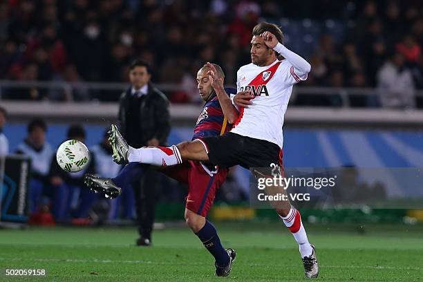 Javier Mascherano of Barcelona and Leonardo Ponzio of River Plate compete for the ball during the FIFA Club World Cup Final Match between FC...