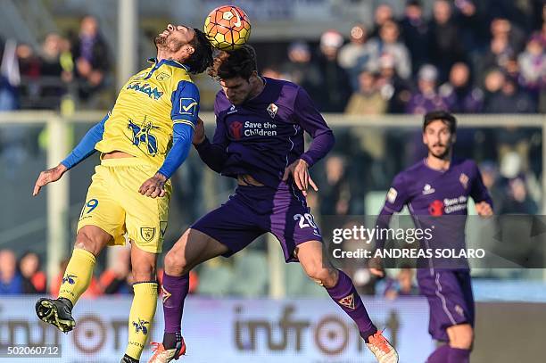 Fiorentina's defender from Spain Marcos Alonso Mendoza fights for the ball with Chievo's midfielder from Argentina Lucas Nahuel Castro during the...