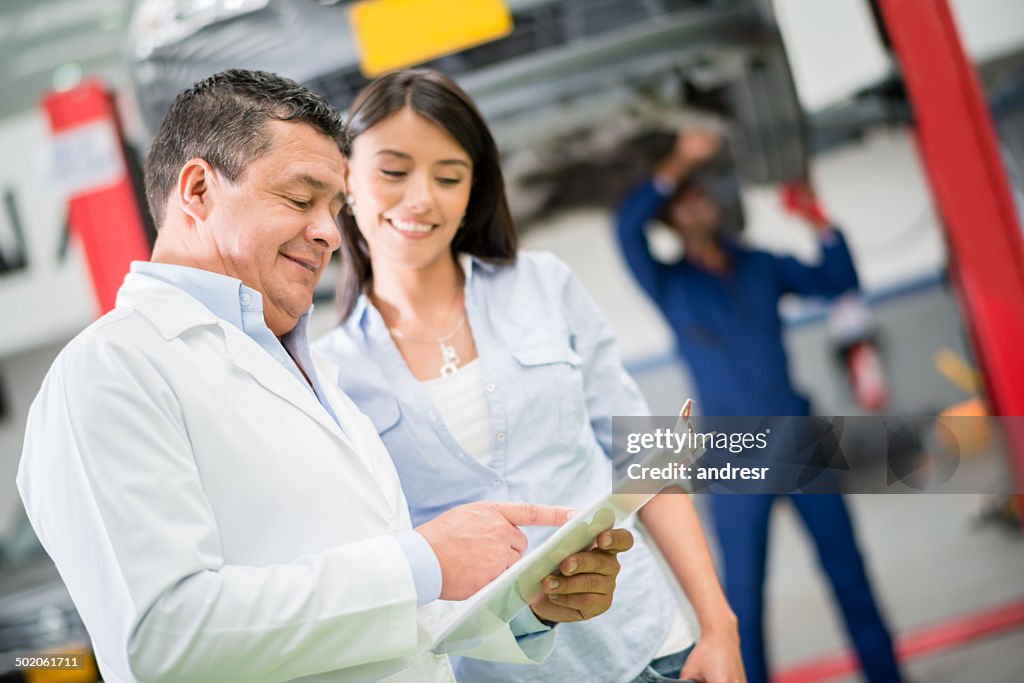 Mechanic talking to client