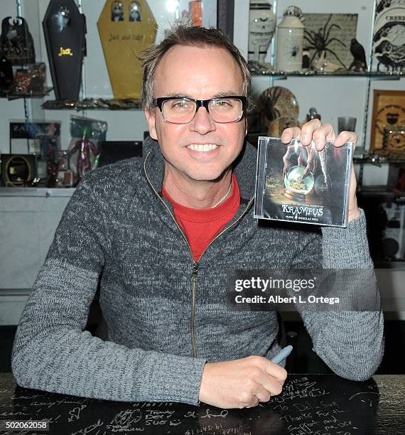 Composer Douglas Pipes poses with the 'Krampus" soundtrack at the Book Signing For "Crimson Peak: Art Of Darkness" held at Dark Delicacies Bookstore...