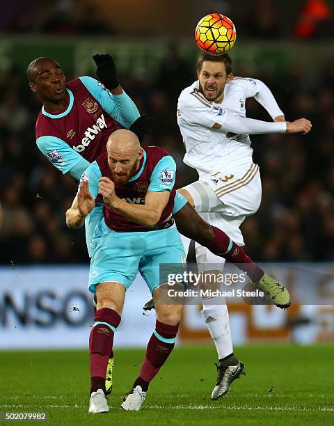 Angelo Ogbonna Obinze and James Collins of West Ham battle for the ball against Gylfi Sigurdsson of Swansea City during the Barclays Premier League...