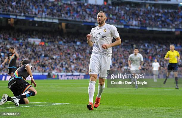 Karim Benzema of Real Madrid celebrates after scoring his team's 5th goal during the La Liga match between Real Madrid and Rayo Vallecano at estadio...