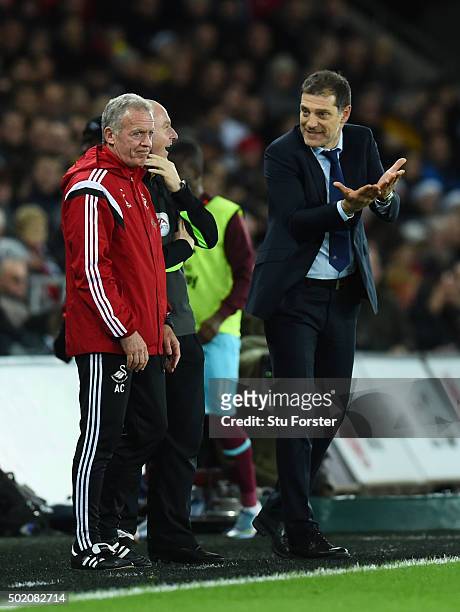Slaven Bilic the manager of West Ham gestures towards Alan Curtis the caretaker manager of Swansea City during the Barclays Premier League match...