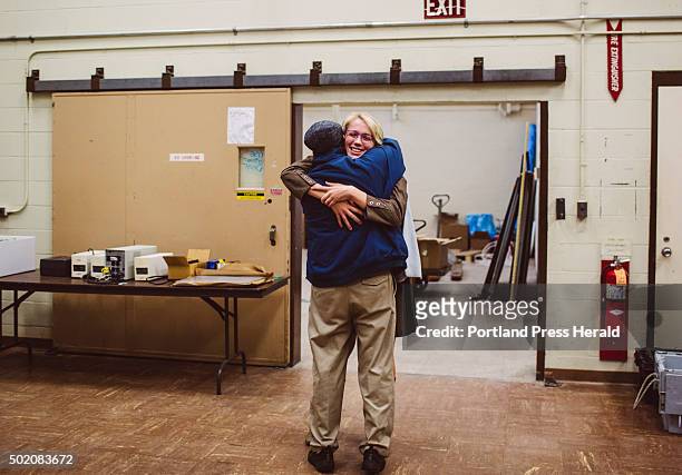 Recently graduated Composites Engineering student Devon Adair hugs SMCC Composites Science and Manufacturing Program chair Andy Schoenberg at...