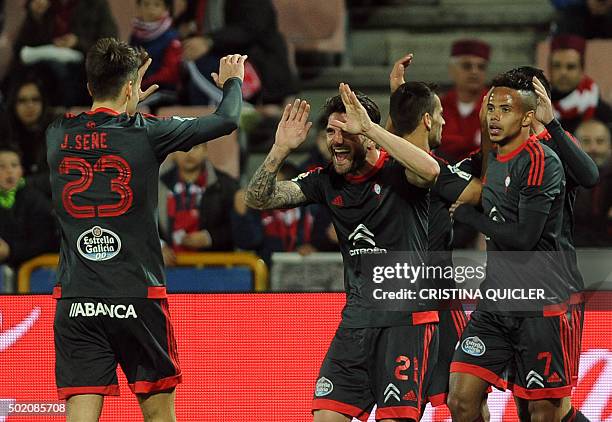 Celta Vigo's forward Josep Sene celebrates with Celta Vigo's defender Carles Planas after scoring during the Spanish league football match Granada FC...