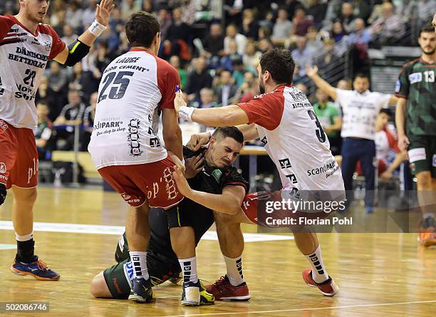 Rasmus Lauge of SG Flensburg-Handewitt, Ignacio Plaza Jimenez of Fuechse Berlin and Tobias Karlsson of SG Flensburg-Handewitt during the game between...