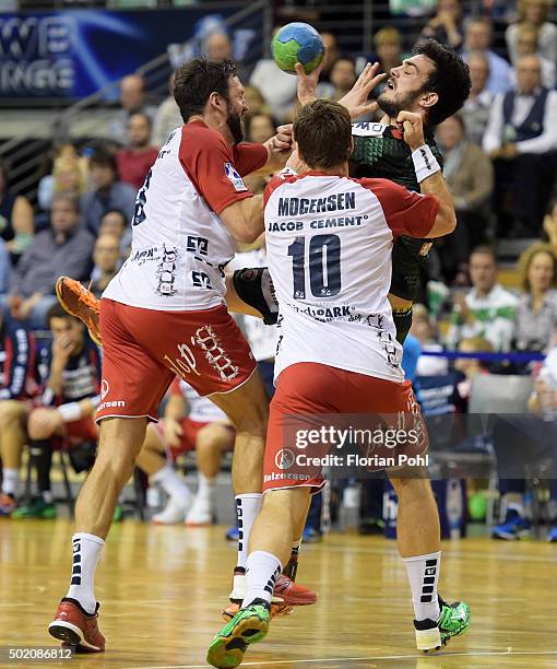 Tobias Karlsson, Thomas Mogensen of SG Flensburg-Handewitt and Petar Nenadic of Fuechse Berlin during the game between Fuechse Berlin and the SG...