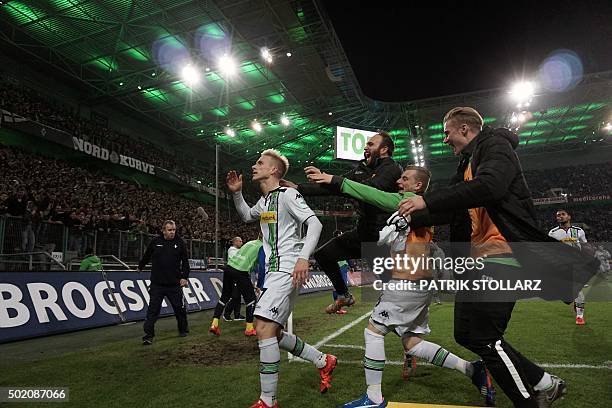 Moenchengladbach's Swedish defender Oscar Wendt celebrates scoring the 3-2 goal during the German first division Bundesliga football match Borussia...