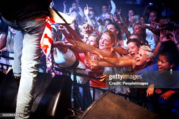 reaching out towards their music idol - american flag on stage stock pictures, royalty-free photos & images