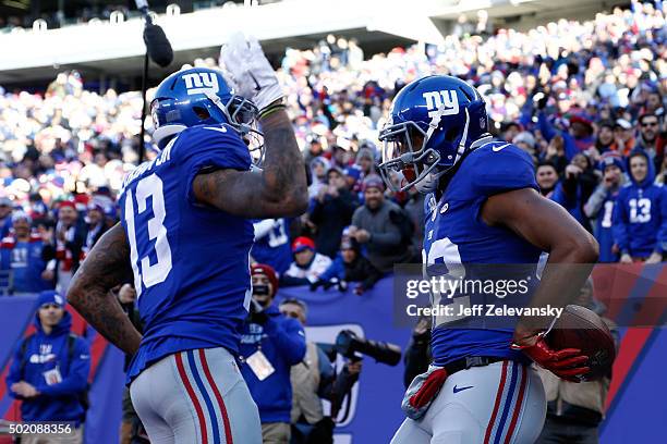 Rueben Randle of the New York Giants celebrates with Odell Beckham after scoring a 27 yard touchdown in the first quarter against the Carolina...