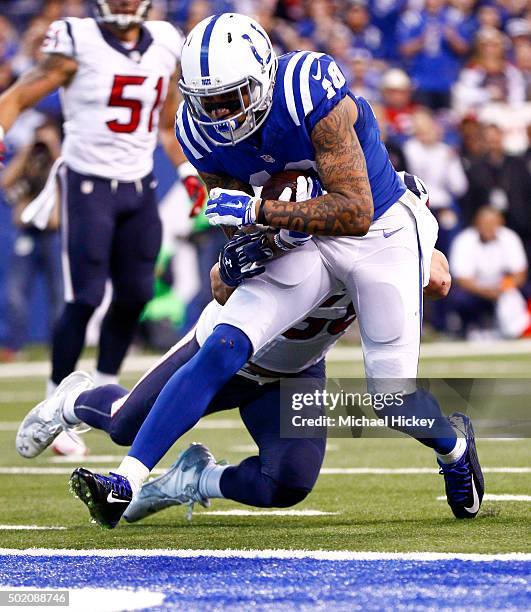 Donte Moncrief of the Indianapolis Colts heads to the end zone past Akeem Dent of the Houston Texans during the second quarter at Lucas Oil Stadium...
