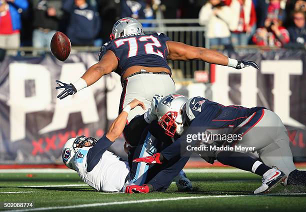 Marcus Mariota of the Tennessee Titans fumbles the football during the second quarter leading to a touchdown by Akiem Hicks of the New England...