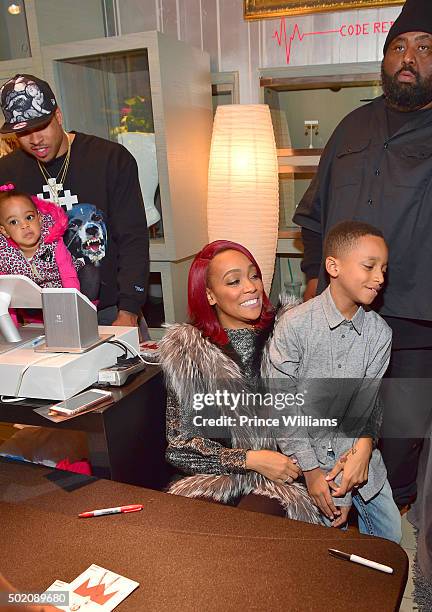Shannon Brown, Laiyah Brown, Monica and Rodney Hill attend Monicas insote signing for "Code Red" at the Julian Scott boutique inside Phipps Plaza on...