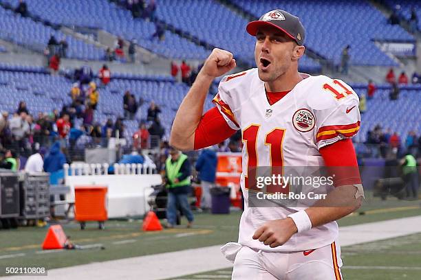 Quarterback Alex Smith of the Kansas City Chiefs celebrates while running off the field following the Chiefs 34-14 win over the Baltimore Ravens at...