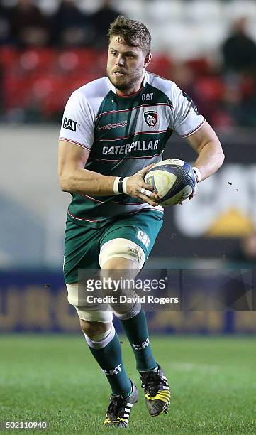 Ed Slater of Leicester runs with the ball during the European Rugby Champions Cup match between Leicester Tigers and Munster at Welford Road on...