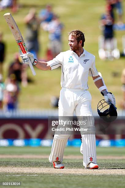 Kane Williamson of New Zealand raises his bat as he makes a century during day four of the Second Test match between New Zealand and Sri Lanka at...