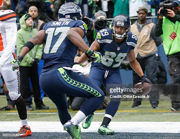 Wide receiver Doug Baldwin of the Seattle Seahawks celebrates with wide receiver Kevin Smith after scoring a touchdown against the Cleveland Browns...
