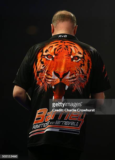 Raymond van Barneveld of Holland shows off his shirt during his first round match against Dirk van Duijvenbode during the 2016 William Hill PDC World...