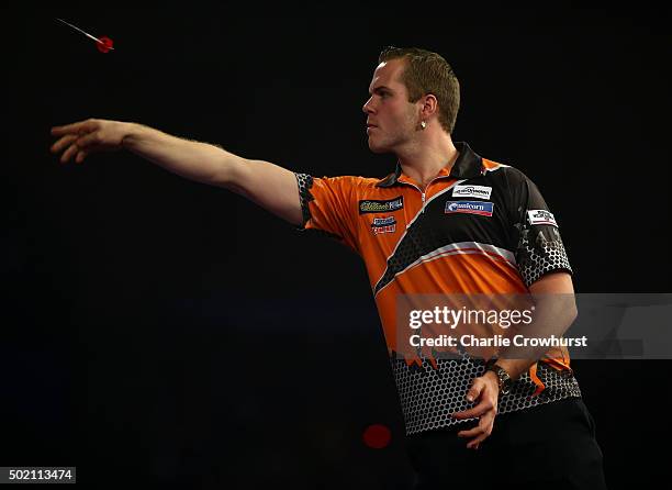 Dirk van Duijvenbode of Holland celebrates winning his first round match against Raymond van Barneveld of Holland during the 2016 William Hill PDC...